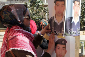 Lt Moaz al-Kassasbeh, shown in these posters, was burned alive by the Islamic State. Photo: Aljazeera <br/>