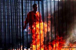 A video released by the Islamic State group shows Jordanian pilot Lt. Muath al-Kaseasbeh being burned alive while trapped in a cage. Photo: Kurdistan Flag/Facebook <br/>