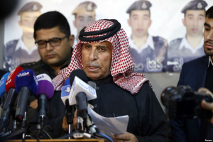 Safi al-Kaseasbeh, center, father of Islamic State captive Jordanian pilot Muath al-Kaseasbeh, speaks at a news conference where he asked Islamic State militants to pardon and release his son, in Amman, Feb. 1, 2015. <br/>
