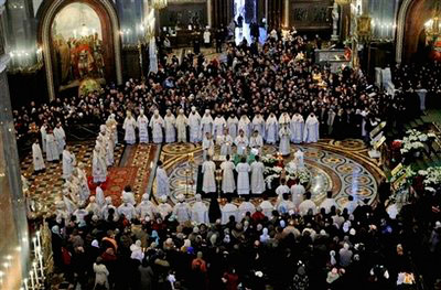 Russian Orthodox church clerics and believers stand around the casket of the late Patriarch Alexy II, center, placed for public viewing in Moscow's Christ the Savior Cathedral, Sunday, Dec. 7, 2008. Alexy II, who died Friday at age 79, led the church for 18 years, from the last year of the officially atheistic Soviet Union through a massive revival that saw it become the world's largest Orthodox church. Alexy's body was taken Saturday to the huge Christ the Savior Cathedral for three days of public viewing and a Tuesday funeral. <br/>(Photo: AP Images / Pool)