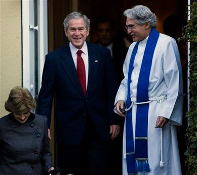 President George W. Bush and first lady Laura Bush are escorted by Rev. Luis Leon, right, as they leave St. John's Episcopal Church, after attending a Sunday church service, Sunday Dec. 7, 2008, in Washington. <br/>(Photo: AP Images / Manuel Balce Ceneta)