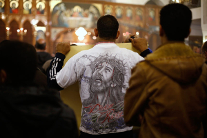 Jordanian Christians attend mass at the Coptic Orthodox Patriarchate in Amman, in memory of the Egyptians beheaded in Libya, February 18, 2015. Christians in Amman held the prayer service, which was attended by representatives of the churches in Jordan, for the Egyptian Christians beheaded by Islamic State in Libya last week. REUTERS/ Muhammad Hamed <br/>