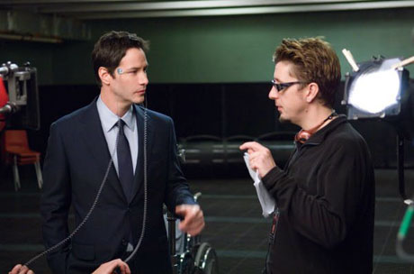 Director Scott Derrickson (right) directs actor Keanu Reeves on the set of <br/>