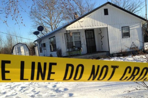 Police are investigating one of the five crime scenes where seven people were shot to death on Thursday evening. Photo: Jeff McNeill, Houston (Mo.) Herald <br/>