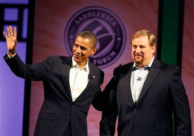 In this Aug. 16, 2008 file photo, then Democratic presidential candidate, Sen. Barack Obama, D-Ill., left, joins Pastor Rick Warren of Saddleback Church, for a discussion on moral issues. Aretha Franklin will sing, Warren will pray and more than 11,000 U.S. troops will be watching over the ceremonies in case of a terrorist attack during President-elect Barack Obama's Inauguration. <br/>(Photo: AP Images / Richard Vogel, File)