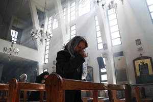 An Assyrian Christian woman attends a mass in the Syrian capital Damascus yesterday in solidarity with the 220 people kidnapped from a string of villages along the Khabur River in Hassakeh last week. Reuters <br/>