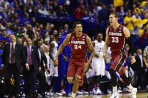 Dwight Powell and Josh Huestis exult after the 10th-seeded Cardinal knocked off the second-seeded Jayhawks in the Round of 32 in St. Louis. Photo credit: Scott Rovak – Reuters <br/>