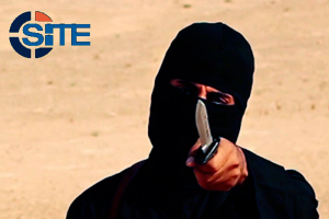 A masked, black-clad militant, who has been identified by the Washington Post newspaper as a Briton named Mohammed Emwazi, brandishes a knife in this still image from a 2014 video obtained from SITE Intel Group February 26, 2015. REUTERS/SITE Intel Group/Handout via Reuters  <br/>