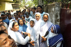 Nuns gather in front of the convent. Archbishop Thomas D'Souza said the sisters prayed for the victim during Sunday Mass. EPA <br/>