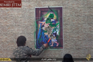 Members of the Islamic State terror group destroy an ancient religious image formerly kept in St. George monastery, located just north of Mosul, Iraq. Photo: MEMRI JTTM <br/>